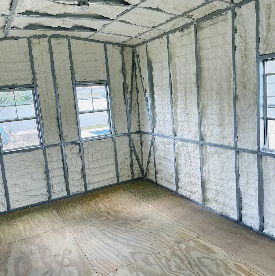 Closed-cell spray foam insulation applied to wall cavities in a residential project in Wimauma
